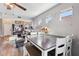 Dining area with a modern table and white chairs at 14885 W Caribbean Ln, Surprise, AZ 85379