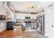 Modern kitchen with stainless steel appliances and wood-look flooring at 14885 W Caribbean Ln, Surprise, AZ 85379