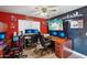 Home office with two desks, multiple monitors, and office chairs at 14885 W Caribbean Ln, Surprise, AZ 85379