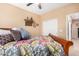 This is a well-lit bedroom with a floral comforter and closet at 15240 N 142Nd Ave # 1149, Surprise, AZ 85379