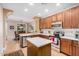 Well-equipped kitchen featuring stainless steel appliances, white countertops, and ample cabinet space at 15240 N 142Nd Ave # 1149, Surprise, AZ 85379