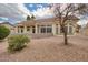 Backyard view highlighting the home's design, landscaping, and covered patio at 15704 W Sentinel Dr, Sun City West, AZ 85375