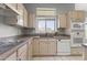 A kitchen showcasing modern appliances, light-colored cabinets, and plenty of counter space for cooking at 15704 W Sentinel Dr, Sun City West, AZ 85375