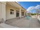 Rear view of the patio showing the covered structure and the surrounding backyard at 15704 W Sentinel Dr, Sun City West, AZ 85375