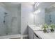 Bright bathroom featuring a glass shower, marble counters, and modern lighting at 15857 N 51St Pl, Scottsdale, AZ 85254