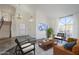 Bright and airy living room featuring tile floors, soaring ceilings, large windows, and neutral colors at 15857 N 51St Pl, Scottsdale, AZ 85254