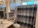 Guest bathroom with shower/tub combo and updated vanity at 17061 W Peregrine Ln, Surprise, AZ 85387