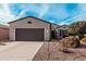 Charming single-story home with a two-car garage, well-maintained landscaping, and inviting curb appeal at 17061 W Peregrine Ln, Surprise, AZ 85387