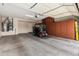 Spacious garage with epoxy floors, built-in cabinets and a golf cart at 17061 W Peregrine Ln, Surprise, AZ 85387