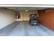 Spacious two-car garage with golf cart and storage cabinets at 17061 W Peregrine Ln, Surprise, AZ 85387