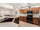 Well-equipped kitchen featuring stainless steel appliances, tile floors, and ample counter space at 17061 W Peregrine Ln, Surprise, AZ 85387