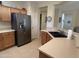 Kitchen with stainless steel appliances and a double sink at 17061 W Peregrine Ln, Surprise, AZ 85387