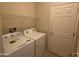 Convenient laundry room with washer, dryer, and storage at 17061 W Peregrine Ln, Surprise, AZ 85387