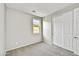 Neutral bedroom with carpeted floors, a closet, and window at 17299 W Desert Sage Dr, Goodyear, AZ 85338