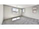 Neutral bedroom with plush carpet, natural light from three windows at 17299 W Desert Sage Dr, Goodyear, AZ 85338