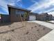 Front view of a single-story house with a driveway and landscaping at 17299 W Desert Sage Dr, Goodyear, AZ 85338