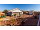 Spacious backyard featuring gravel landscaping, an outdoor seating area, and perimeter fencing at 1937 W Burgess Ln, Phoenix, AZ 85041