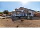 Expansive front lawn featuring desert landscaping and a charming two story home at 1937 W Burgess Ln, Phoenix, AZ 85041