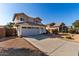 Charming home with a well-maintained front yard, a spacious driveway, and a two car garage at 1937 W Burgess Ln, Phoenix, AZ 85041