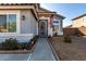 Inviting front entry featuring an ornate security door and well-manicured landscaping at 1937 W Burgess Ln, Phoenix, AZ 85041