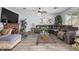 Cozy living room with a corner fireplace, hardwood floors, and plush seating at 1937 W Burgess Ln, Phoenix, AZ 85041