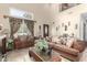 Elegant living room with high ceilings, oversized windows, and designer furnishings at 1937 W Burgess Ln, Phoenix, AZ 85041