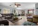 Bright, open-concept living room with hardwood floors and neutral paint at 1937 W Burgess Ln, Phoenix, AZ 85041