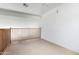 Bright loft space with carpet and wood railings at 1937 W Burgess Ln, Phoenix, AZ 85041