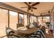 Sunroom with lots of windows, ceiling fans, and an ornate seating area at 1937 W Burgess Ln, Phoenix, AZ 85041