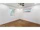 Simple bedroom with brown stained concrete floors and ceiling fan at 2317 W W Whitton Ave Ave, Phoenix, AZ 85015