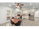 Updated kitchen with white cabinets, geometric tile floor and breakfast nook at 2317 W W Whitton Ave Ave, Phoenix, AZ 85015