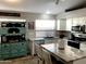 Bright kitchen with an island and white cabinetry at 2342 W Blue Sky Dr, Phoenix, AZ 85085