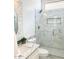 Elegant bathroom showcasing a glass-enclosed shower with marble tile and a stylish vanity with sink at 24084 N 77Th St, Scottsdale, AZ 85255