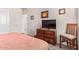 Bedroom featuring a television, closet and neutral walls at 24338 W Albeniz Pl, Buckeye, AZ 85326