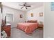 Comfortable bedroom with carpet, ceiling fan, and natural light from the window at 24338 W Albeniz Pl, Buckeye, AZ 85326