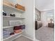 Bright bedroom featuring closet with shelving and view to the primary bedroom at 24338 W Albeniz Pl, Buckeye, AZ 85326