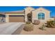 Charming single-story home with a two-car garage and manicured landscaping at 24338 W Albeniz Pl, Buckeye, AZ 85326