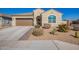 Charming single-story home featuring a two-car garage and desert landscaping for low maintenance at 24338 W Albeniz Pl, Buckeye, AZ 85326