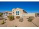 Beautiful single story home with low maintenance desert landscaping, with a blue sky above at 24338 W Albeniz Pl, Buckeye, AZ 85326