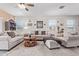 Inviting living room featuring neutral tones, plush seating, and elegant decor for relaxation and comfort at 24338 W Albeniz Pl, Buckeye, AZ 85326