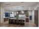 Gourmet kitchen boasts expansive island, modern cabinetry, and high-end appliances at 24923 N 91 St, Scottsdale, AZ 85255