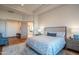 Elegant guest bedroom with wood floors and ensuite bathroom access at 25453 N 113Th Way, Scottsdale, AZ 85255