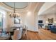 Open dining room with a chandelier, and views into the living room at 25453 N 113Th Way, Scottsdale, AZ 85255