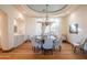 Elegant dining room features a large table, chandelier, and built-in cabinetry at 25453 N 113Th Way, Scottsdale, AZ 85255