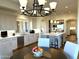 Open kitchen with island, stainless steel appliances, and adjacent dining area at 25453 N 113Th Way, Scottsdale, AZ 85255