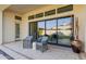 Spacious back patio with glass doors and comfortable seating at 2706 E Lovebird Ln, Gilbert, AZ 85297