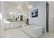 Spa-like Primary bathroom with soaking tub and dual vanity at 2706 E Lovebird Ln, Gilbert, AZ 85297