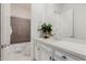 Clean bathroom with white cabinets and gray tile shower at 2706 E Lovebird Ln, Gilbert, AZ 85297