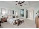 Main bedroom with plush carpet, large window and ceiling fan at 2706 E Lovebird Ln, Gilbert, AZ 85297