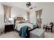 Bedroom with dark wood bed frame and teal bedding at 2706 E Lovebird Ln, Gilbert, AZ 85297